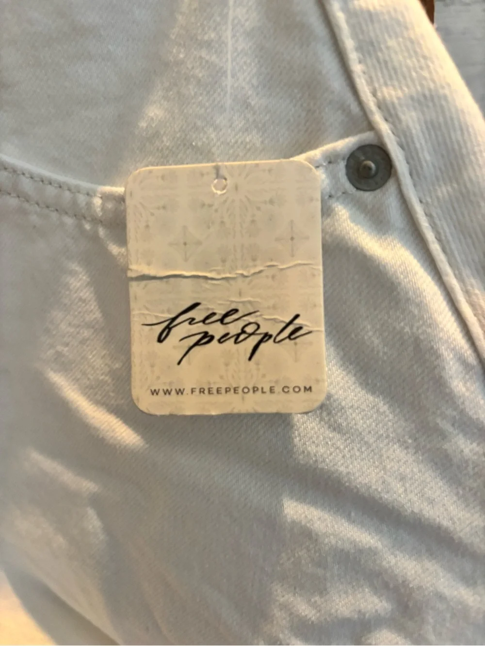 Free People white denim shorts